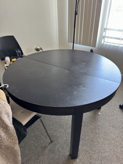 Black extendable table With Four Chairs.