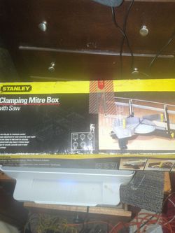 Clamping miter box with saw