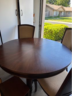 Dining room table with 6 chairs and leaf extention