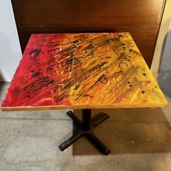 small cafe style table with iron base
