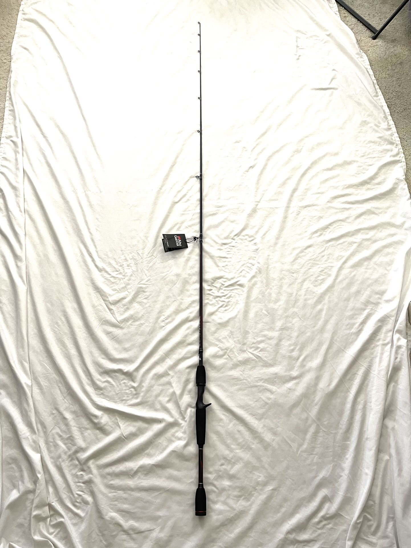 Brand New With Tags Abu Garcia (Black Max) 6.6ft Medium Action Fishing Rod. This is for a bait caster fishing reel.