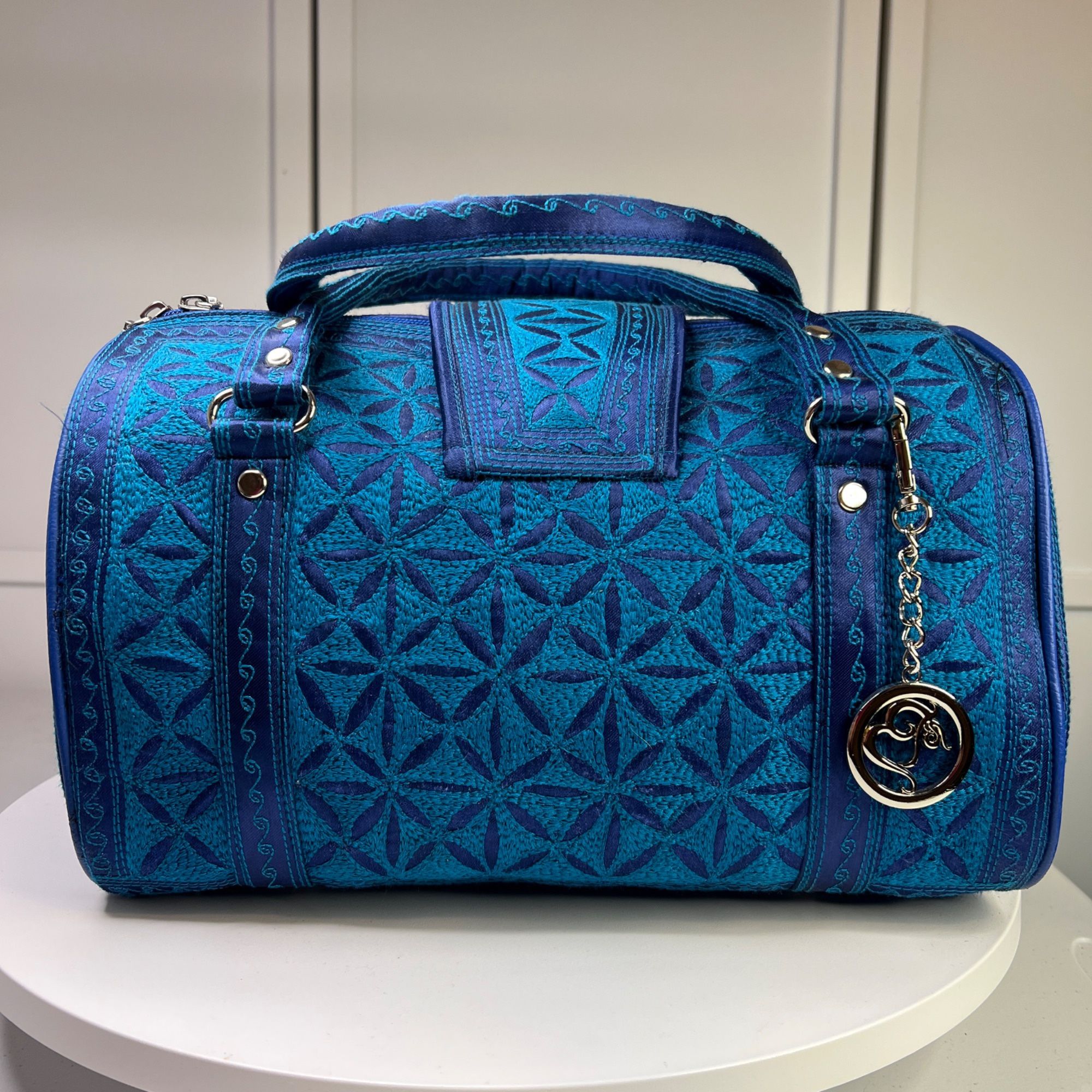 Blue Banda Barrel Bag With Intricate Embroidery & Detachable Charm