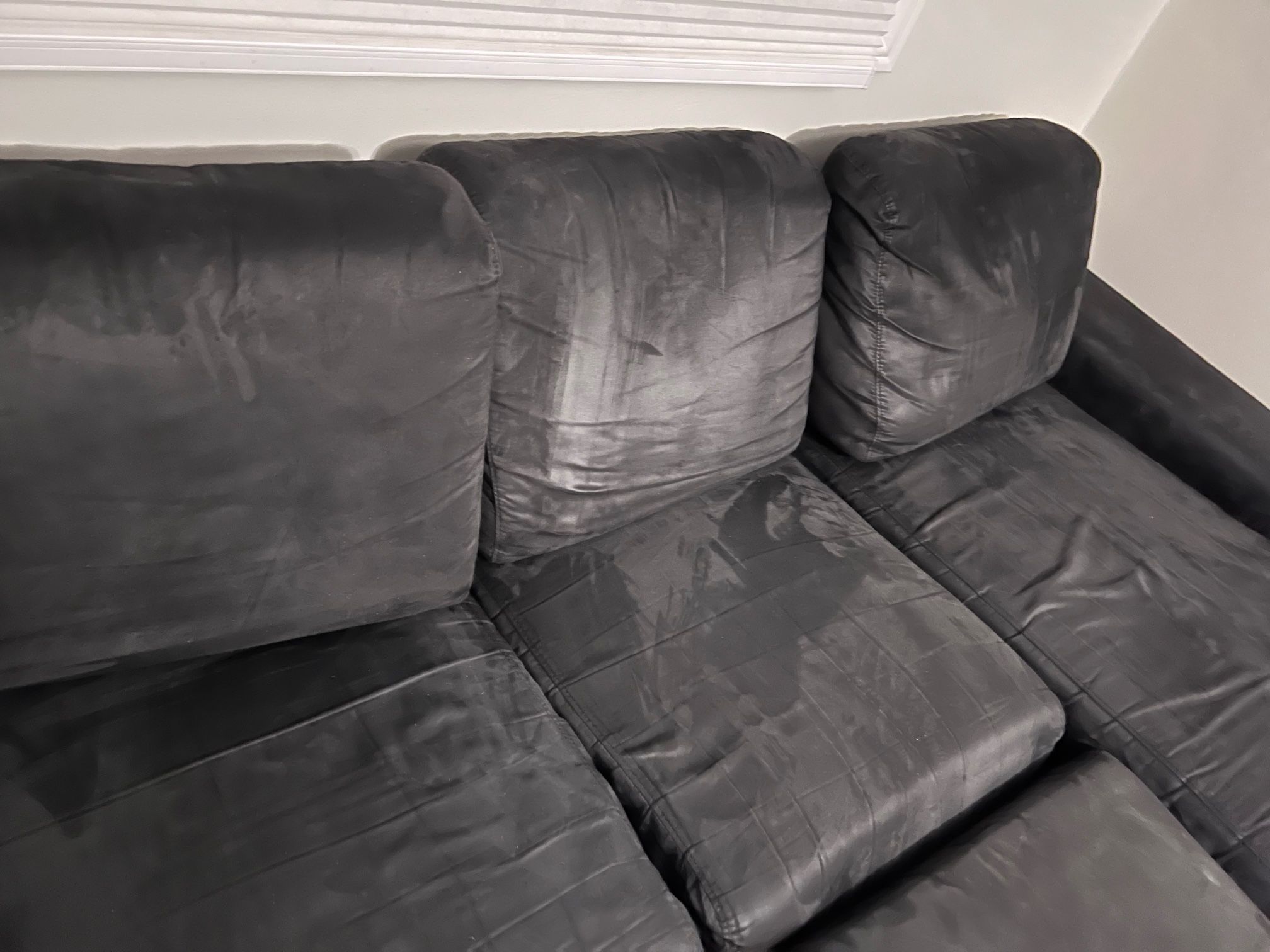 Black Couch, Two Pieces, With Ottoman And Three Cushions