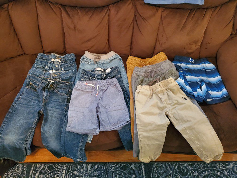 12 piece lot of jeans,pants, and shorts/ swimming trunks
