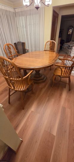 Oak pedestal dining table and chairs