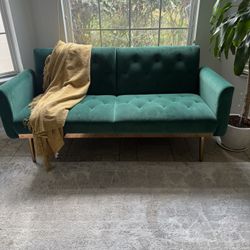 Green Futon With Area Rug (5x8)