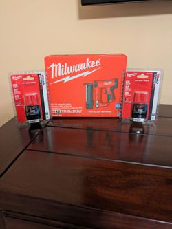 Milwaukee M12 23 gauge pin nailer and two batteries new in original packaging