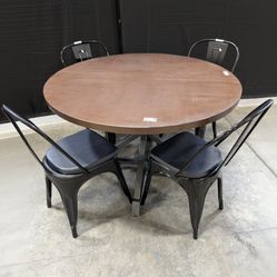 Industrial Style Round Dining Table with Four Black Metal Chairs