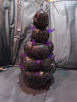 Black pumpkin with purple lights ceramic tree. Lights do not work