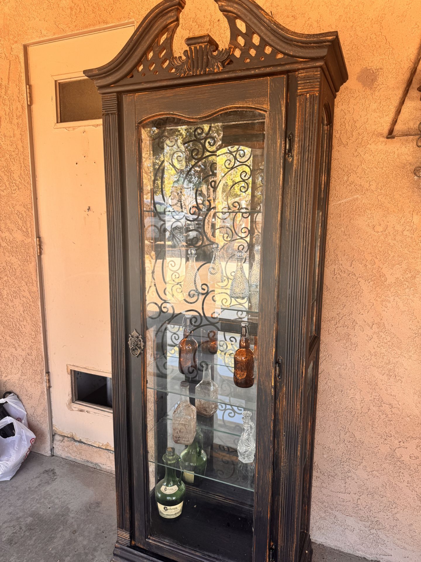 Gothic Victorian style cabinet with shelves and light