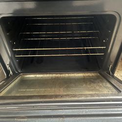 Black Kenmore Refrigerated and Gas Stove