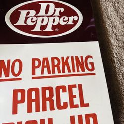 sign for "Dr Pepper" with the text "NO PARKING PARCEL PICK-UP ONLY 38 X 21x1