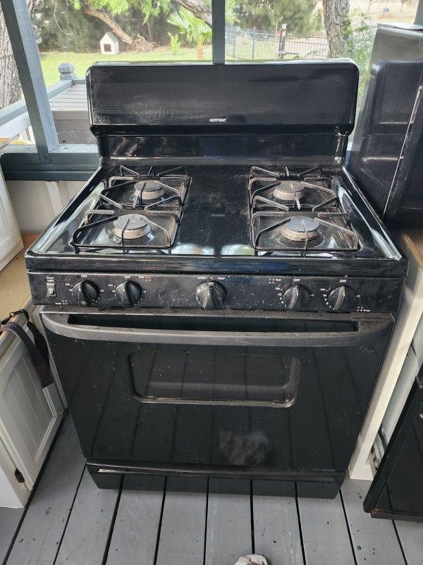 Hot Point Black Stove W/oven. $225. Everything Works!! I Also A STAND alone Wall Oven, And A MICROWAVE $100.