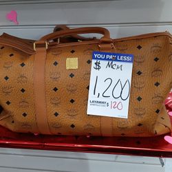 Louis Vuitton Duffle Bag. MCM Duffle Bag 