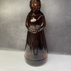 (1) Mrs. Butterworth's 10" Dark Amber Glass Syrup Bottle With Plastic Lid. 