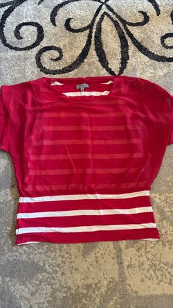 Red shirt with red and white striped undergarment