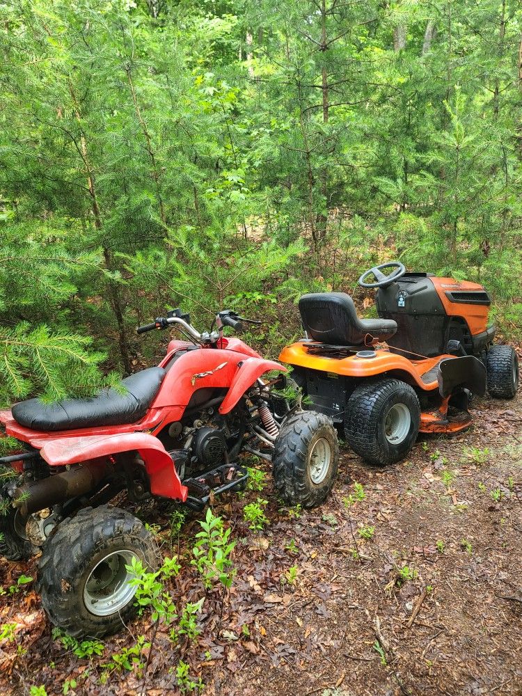 Husqvarna Riding lawn mower.
And 4 Wheeler.