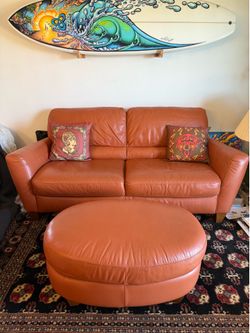 Orange couch with foot rest