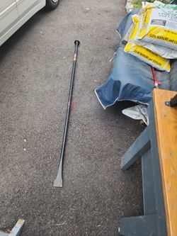 Post hole digger and tamping bar