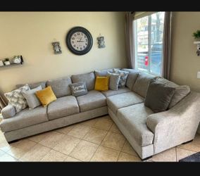 Comfortable Beige sectional couch from Jerome’s