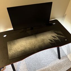 Gaming desk with monitor and mousepad