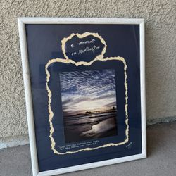 Framed signed coastal photograph of the Huntington Beach Pier at sunset titled “Moment – Huntington Bch, Ca.” by California nature photographer Harry 