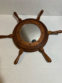 vintage nautical ship's wheel porthole wall mirror featuring a wooden helm frame, six handles