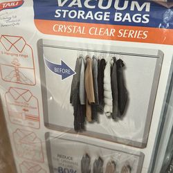 Space Saver Garment Bags w/built In Hanger. Use To Store Winter Coats or Seasonal Clothing. New In Package Of 4  $10