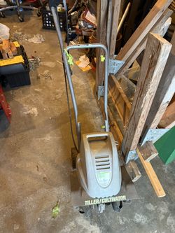 Earth tiller cultivator