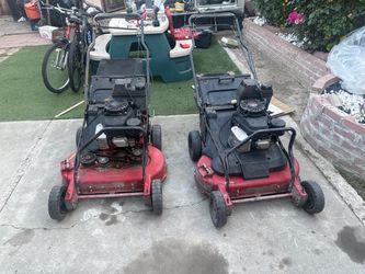 Two Red Gas Push Lawn Mowers
