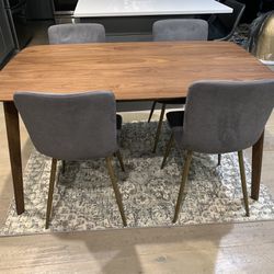 Dining Room Table With Four Fabric Chairs With Metal Legs