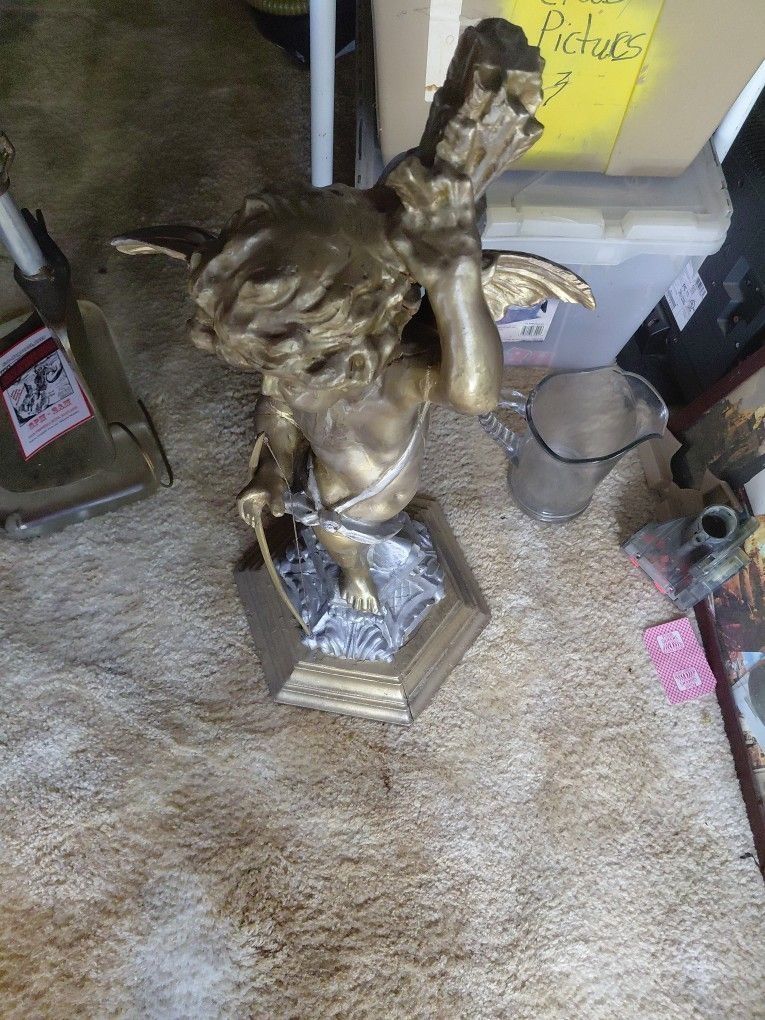 Angel With Arrow Statue