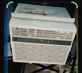 white GE window air conditioner, specifically a smart electronic model