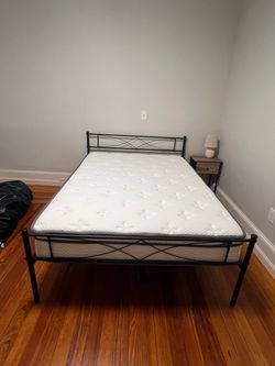 Black Metal Bed Frame with Full Sized Mattress