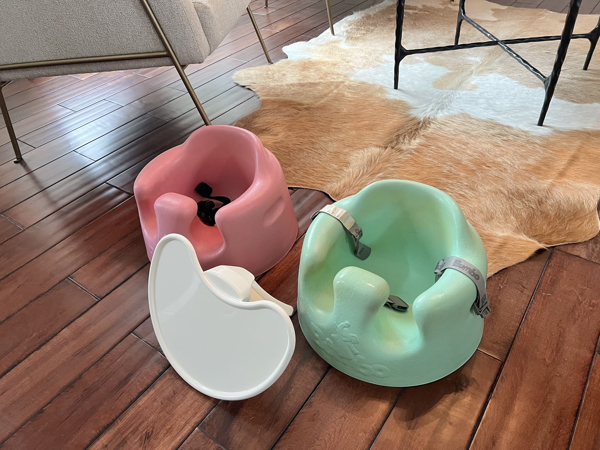 Two Bumbo Infant Seats and One Tray