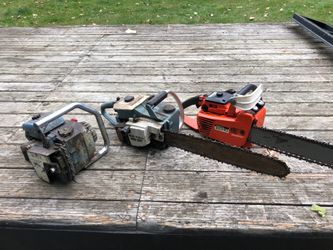 2 vintage chainsaws