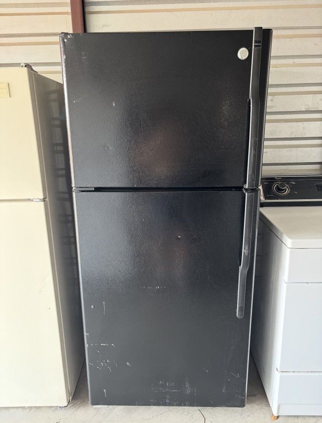 Black GE Refrigerator And Freezer