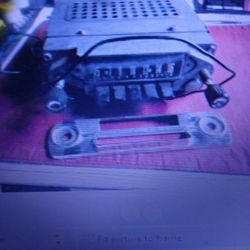 1963 Ford AM Radio With Knobs And Chrome Faceplate Pistol