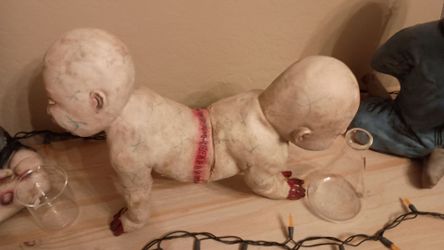 Two-Headed Horror Baby Doll Prop