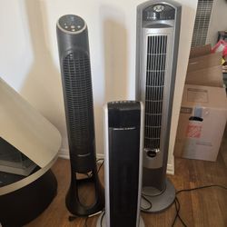 2 Standing Fans And A Space Heater 