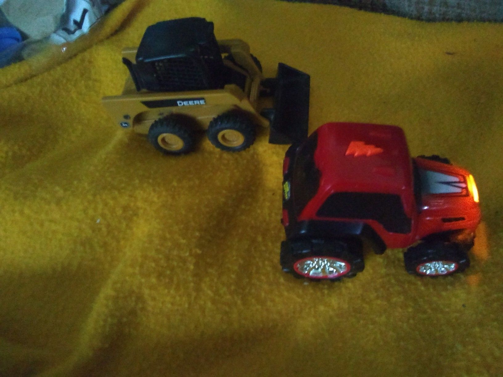 A John Deere mini front in loader & a road rippers tractor!