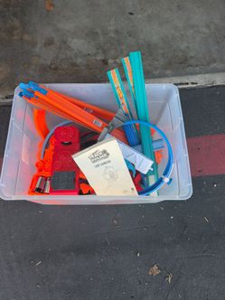 An assortment of Hot wheel track and boosters