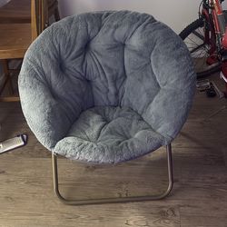 2 fur saucer chairs.