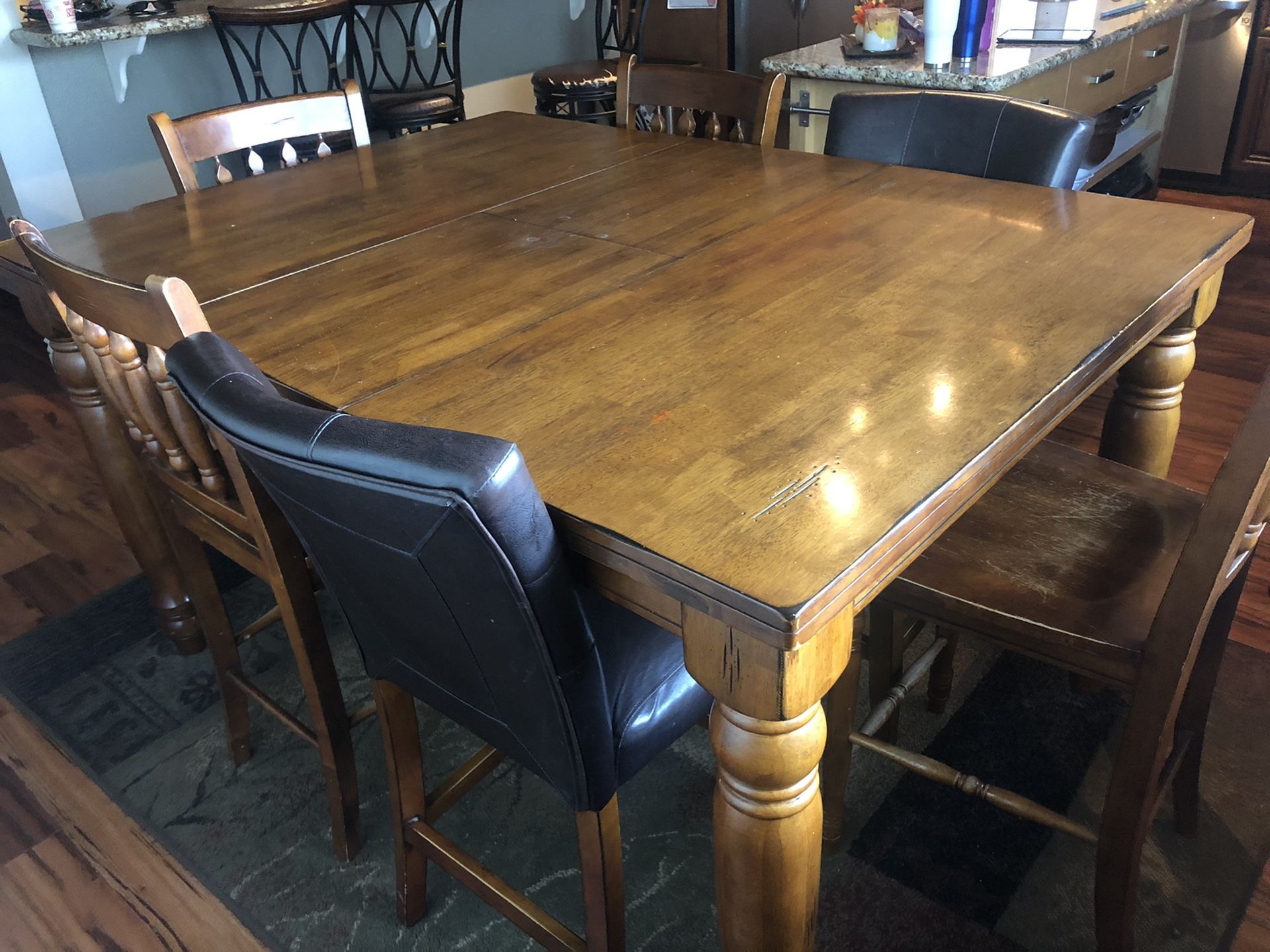 Bar height dining room table with chairs