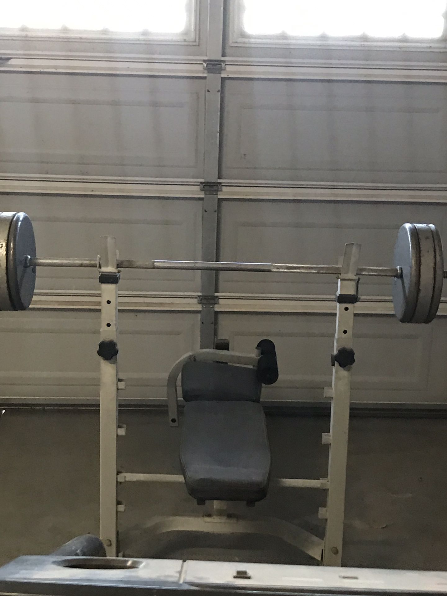 Weights, bench, bar, and over 350 pounds of iron plates. Different size plates from 25 pound to 8.5 pound plates