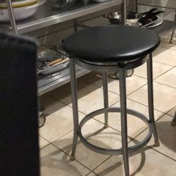 All Four Countertop Height Bar Stools. Stainless And Black Leather.
