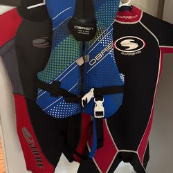 2 Kids Wet Suits And 1 Infant Life Jacket 