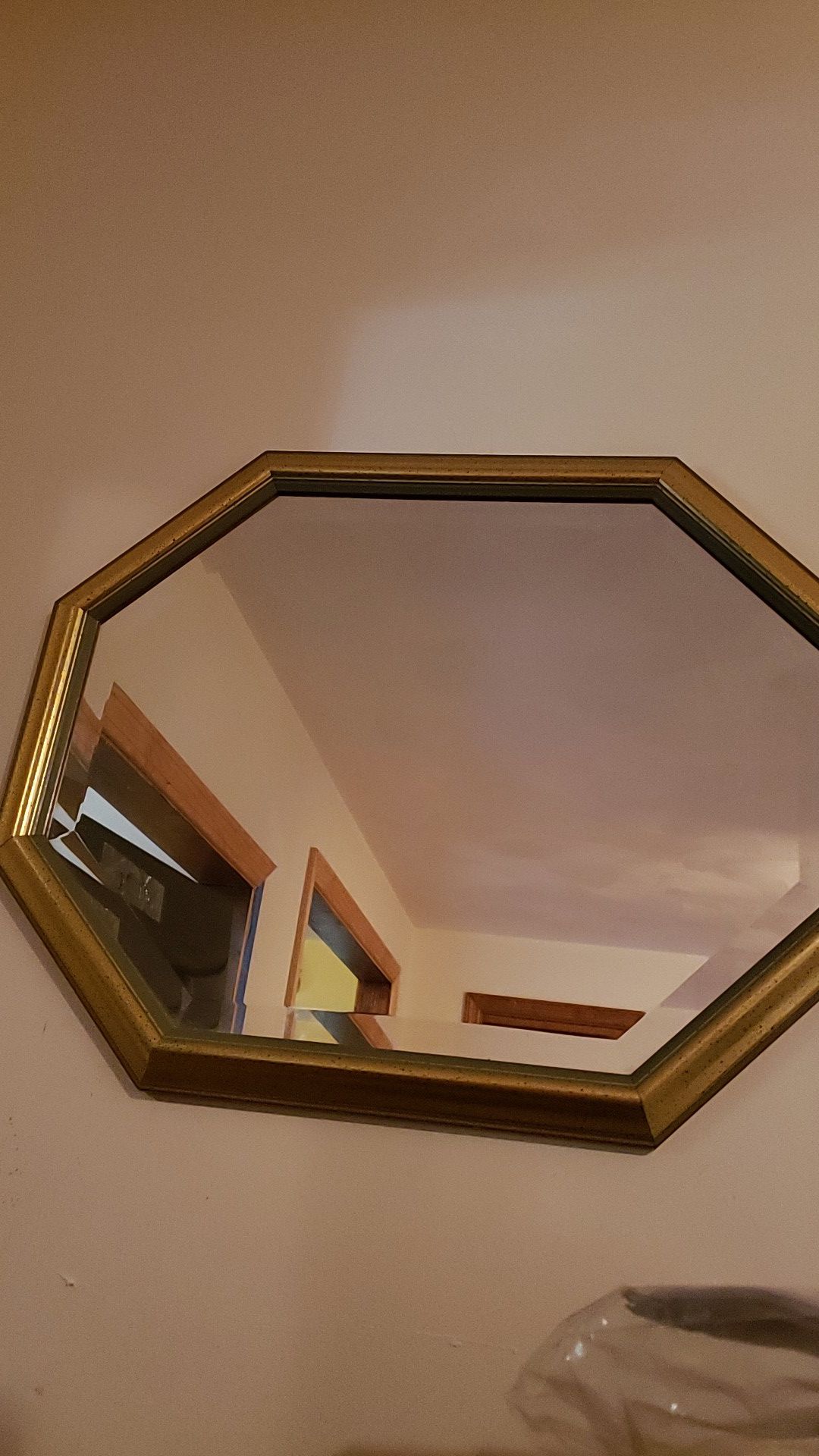 Wall mirror with gold trim