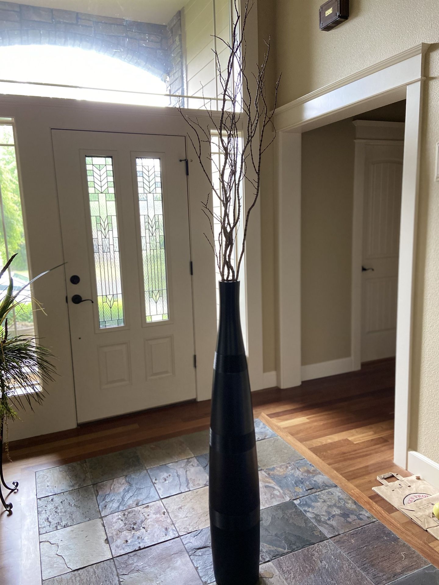Tall floor vase with branches