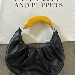  PUPPETS AND PUPPETS Banana ruched leather hobo bag